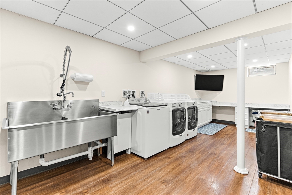 10 Viking Road Winchester, MA 01890 - Photo 33 of 42 a open kitchen with a sink and a stove top oven