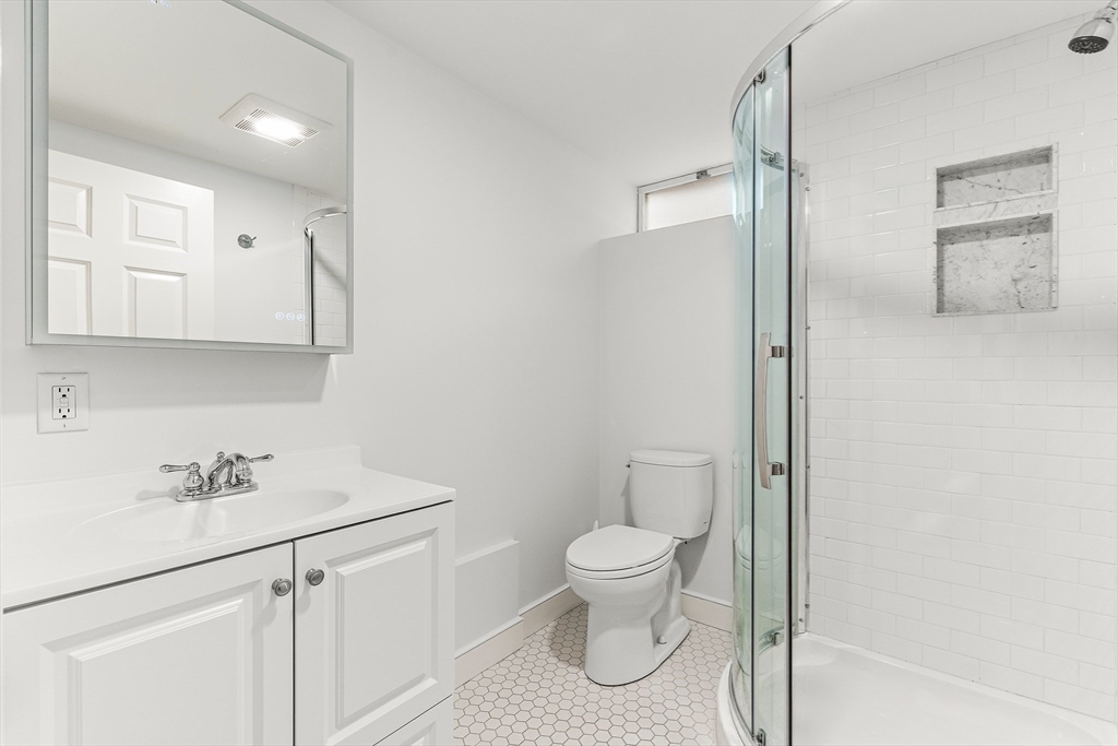 10 Viking Road Winchester, MA 01890 - Photo 34 of 42 a bathroom with a toilet sink and mirror