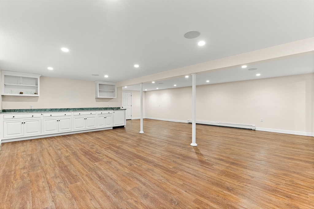10 Viking Road Winchester, MA 01890 - Photo 35 of 42 a view of a kitchen with a sink and wooden floor