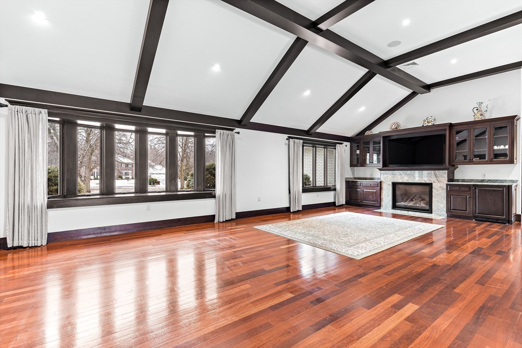 10 Viking Road Winchester, MA 01890 - Photo 6 of 42 a view of an empty room with a fireplace and a window