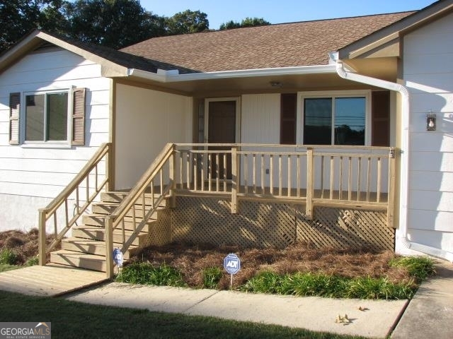 7597 Fielder Road Jonesboro, GA 30236 - Photo 1 of 1 a view of a house with backyard and porch