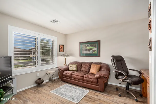a living room with furniture and a window