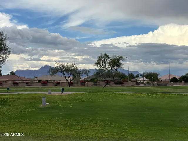 a view of a golf course with a big yard
