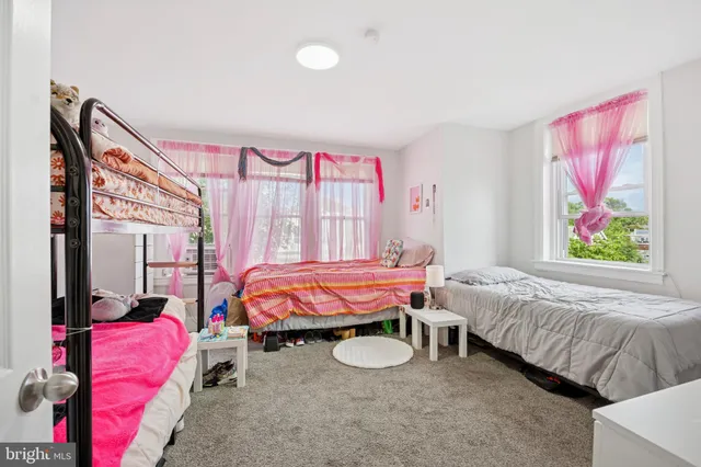 a bedroom with bed and a couch