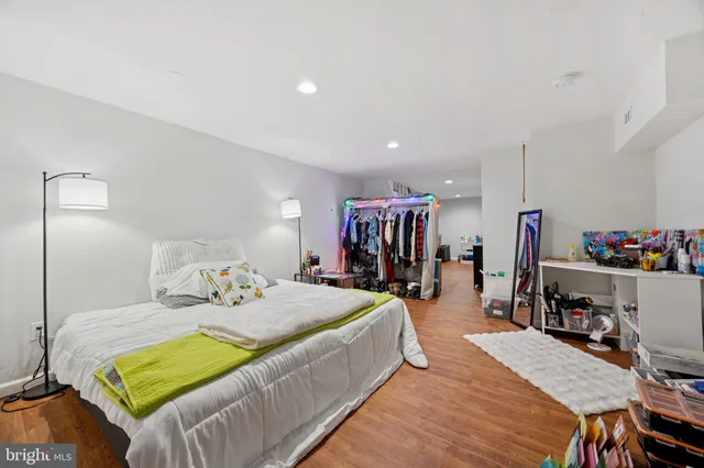 a bedroom with a bed and a table in it