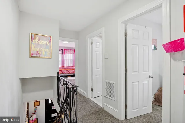 a view of a hallway with workspace
