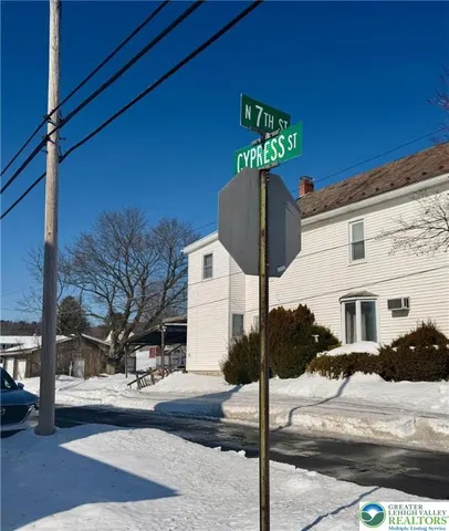 a front view of a building with street view