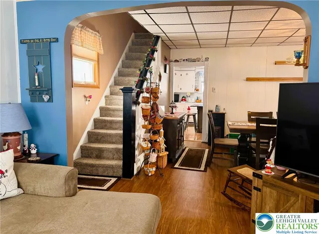 a living room with furniture and a flat screen tv