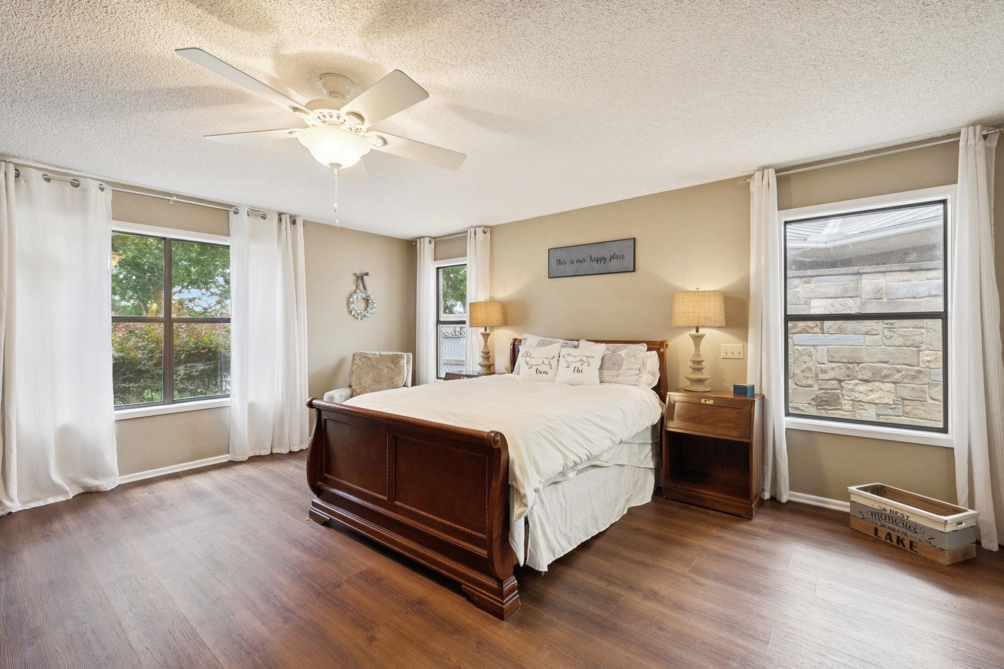 180 Wampum Way Seguin, TX 78155 - Photo 13 of 24 a spacious bedroom with a bed and a window