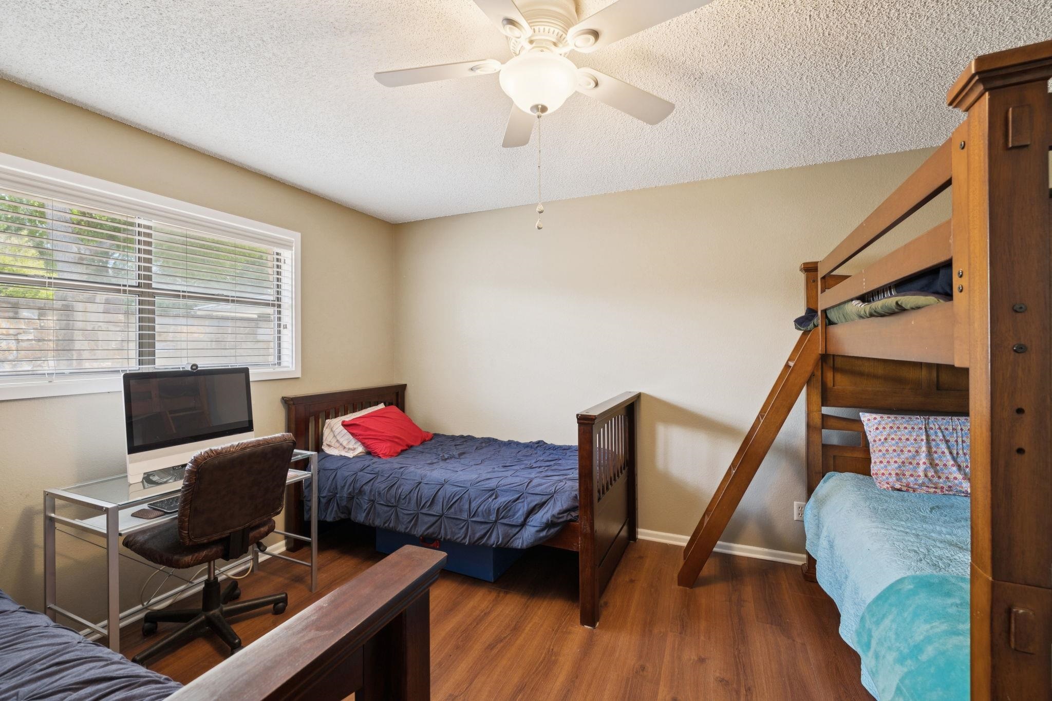 180 Wampum Way Seguin, TX 78155 - Photo 14 of 24 a workspace with furniture and wooden floor