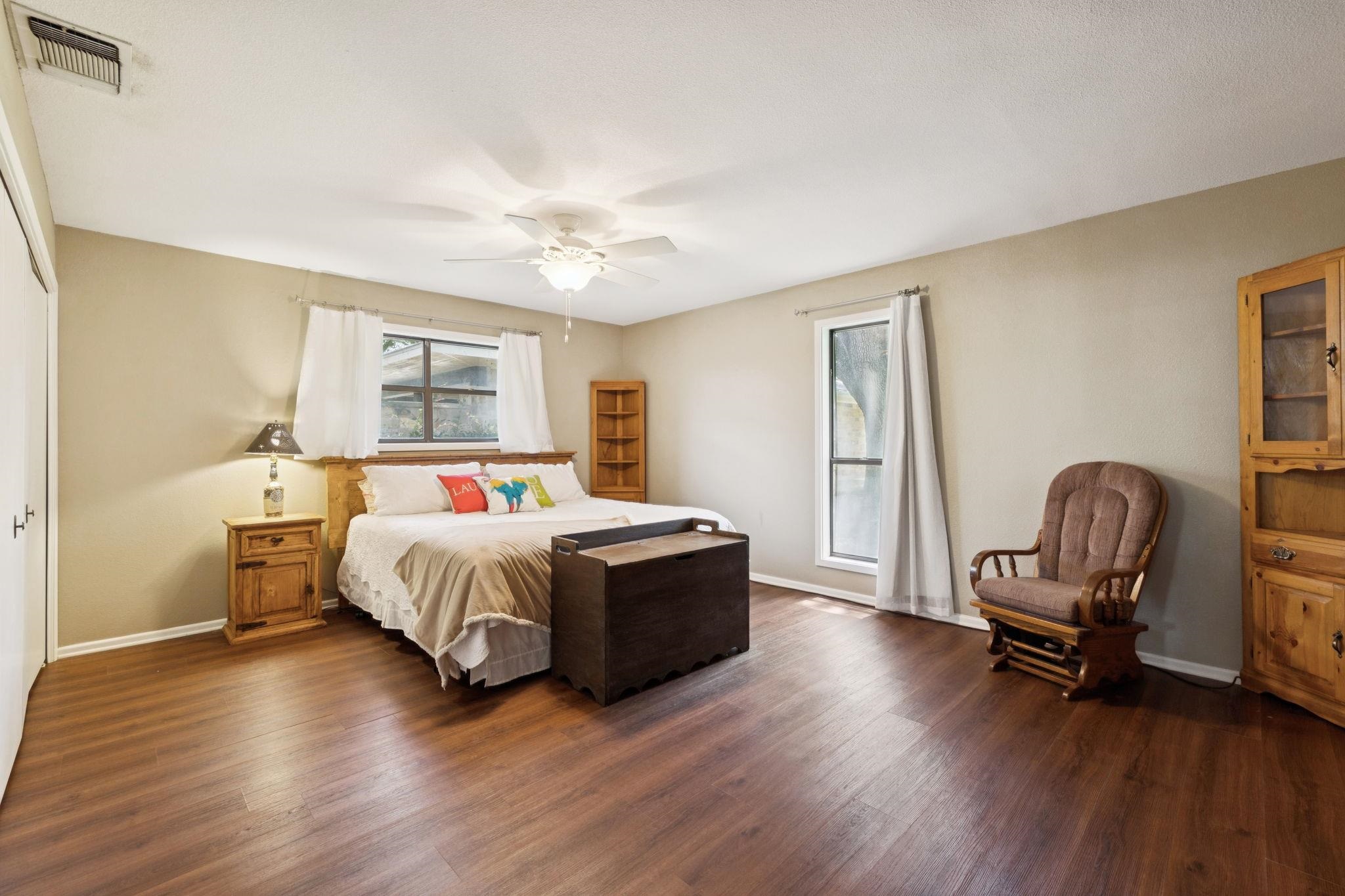 180 Wampum Way Seguin, TX 78155 - Photo 16 of 24 a bedroom with a bed and a chair