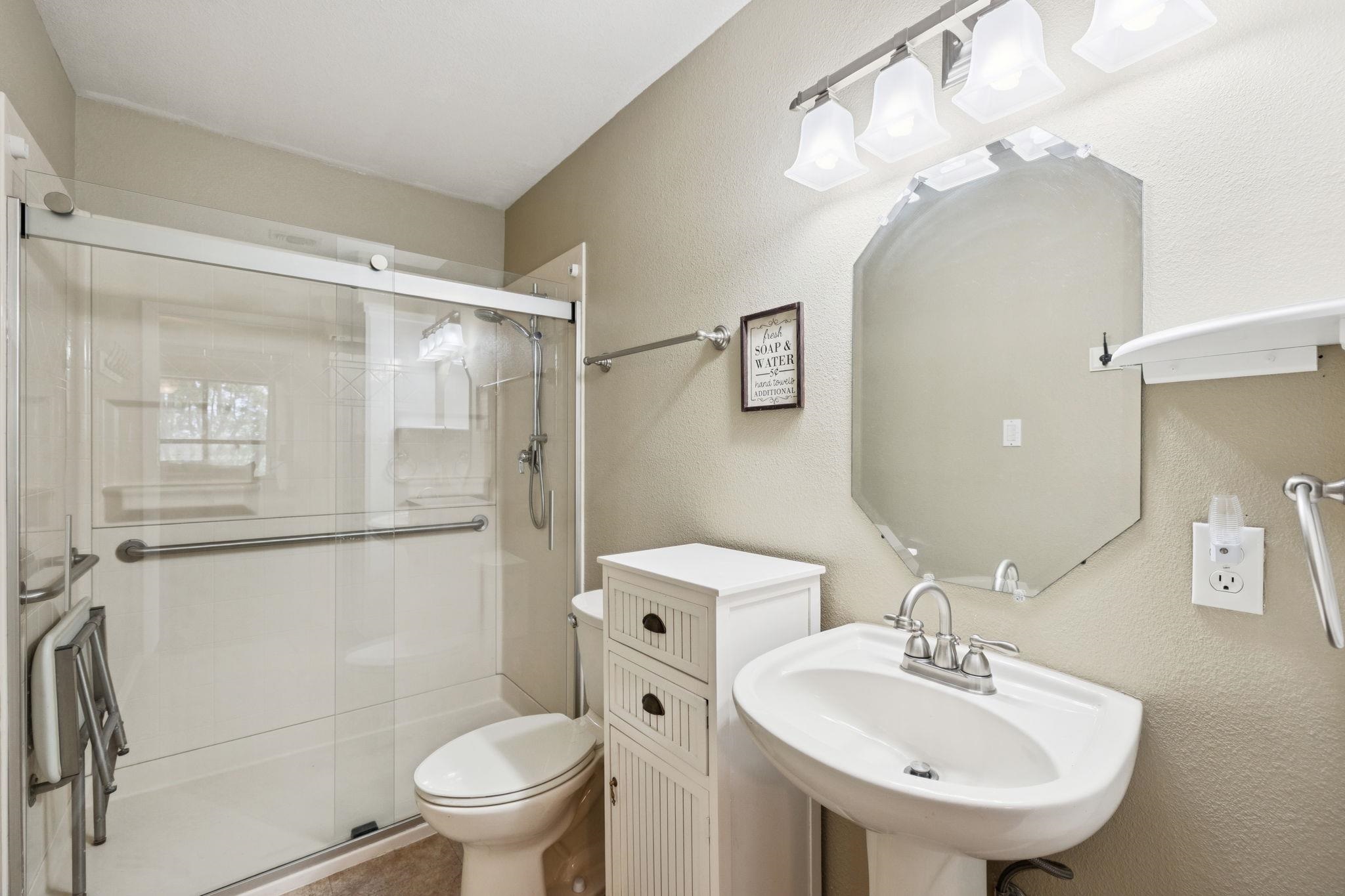 180 Wampum Way Seguin, TX 78155 - Photo 23 of 24 a bathroom with a sink toilet and shower
