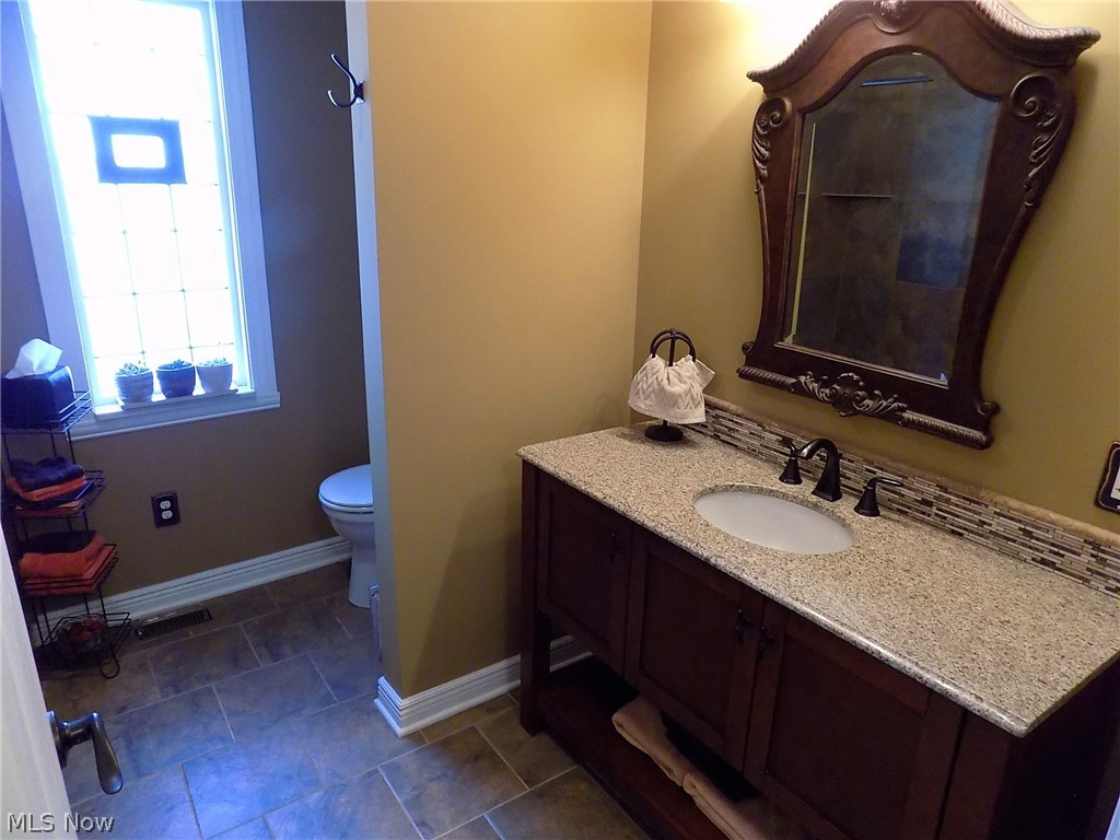 25769 Butternut Ridge Road North Olmsted, OH 44070 - Photo 14 of 35 Large first floor bathroom with spacious granite countertop vanity & walk-in shower.