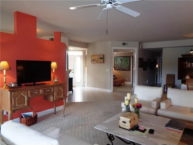 a bedroom with a bed and a chair