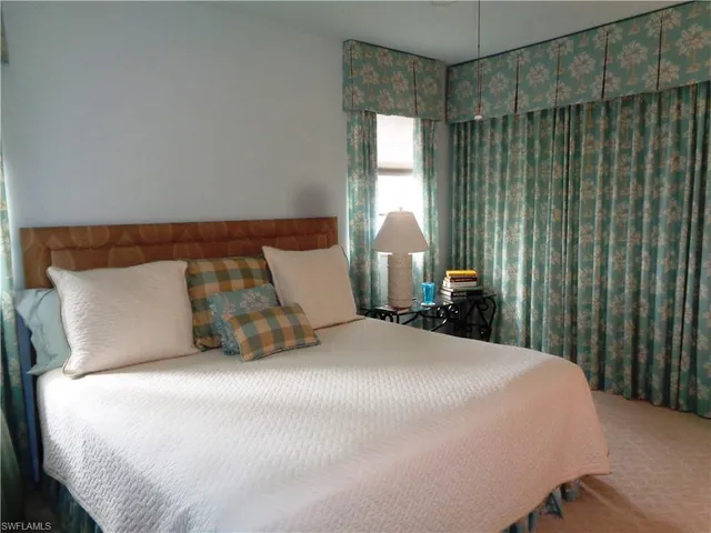 a bathroom with a sink mirror and a bath tub