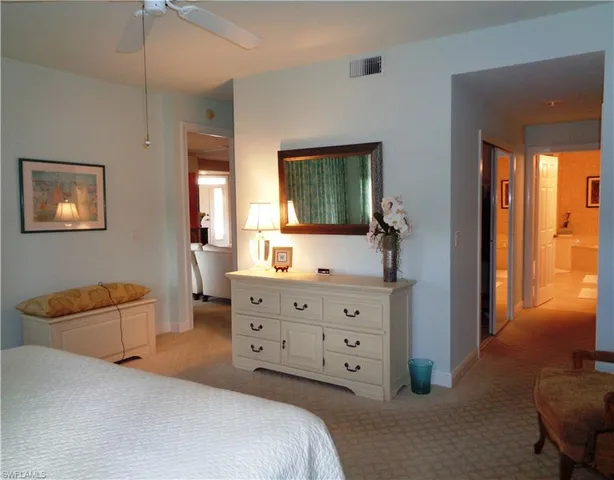 a bathroom with a tub a sink and shower