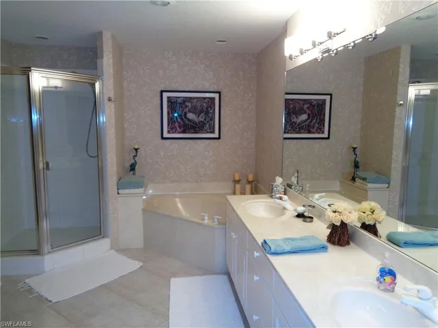 a bedroom with furniture and a flat screen tv