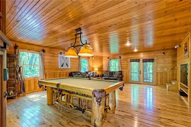 a bathroom with a granite countertop shower and a sink
