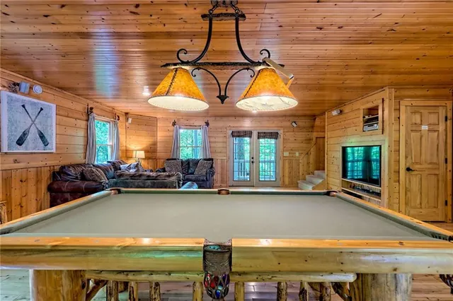 a bedroom with a bed and a fireplace