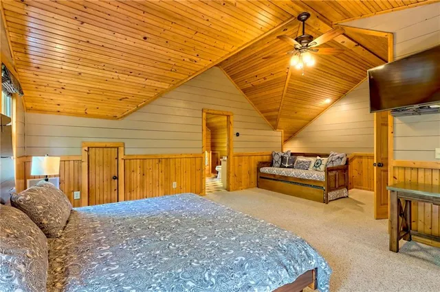 a kitchen with stainless steel appliances granite countertop a sink a stove and refrigerator