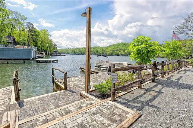 a view of a swimming pool with a patio and a garden