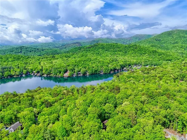 a view of living room with furniture and floor to ceiling window