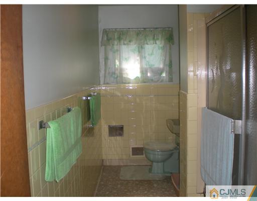 168 Princeton Road Old Bridge, NJ 08859 - Photo 8 of 10 a bathroom with a glass shower door