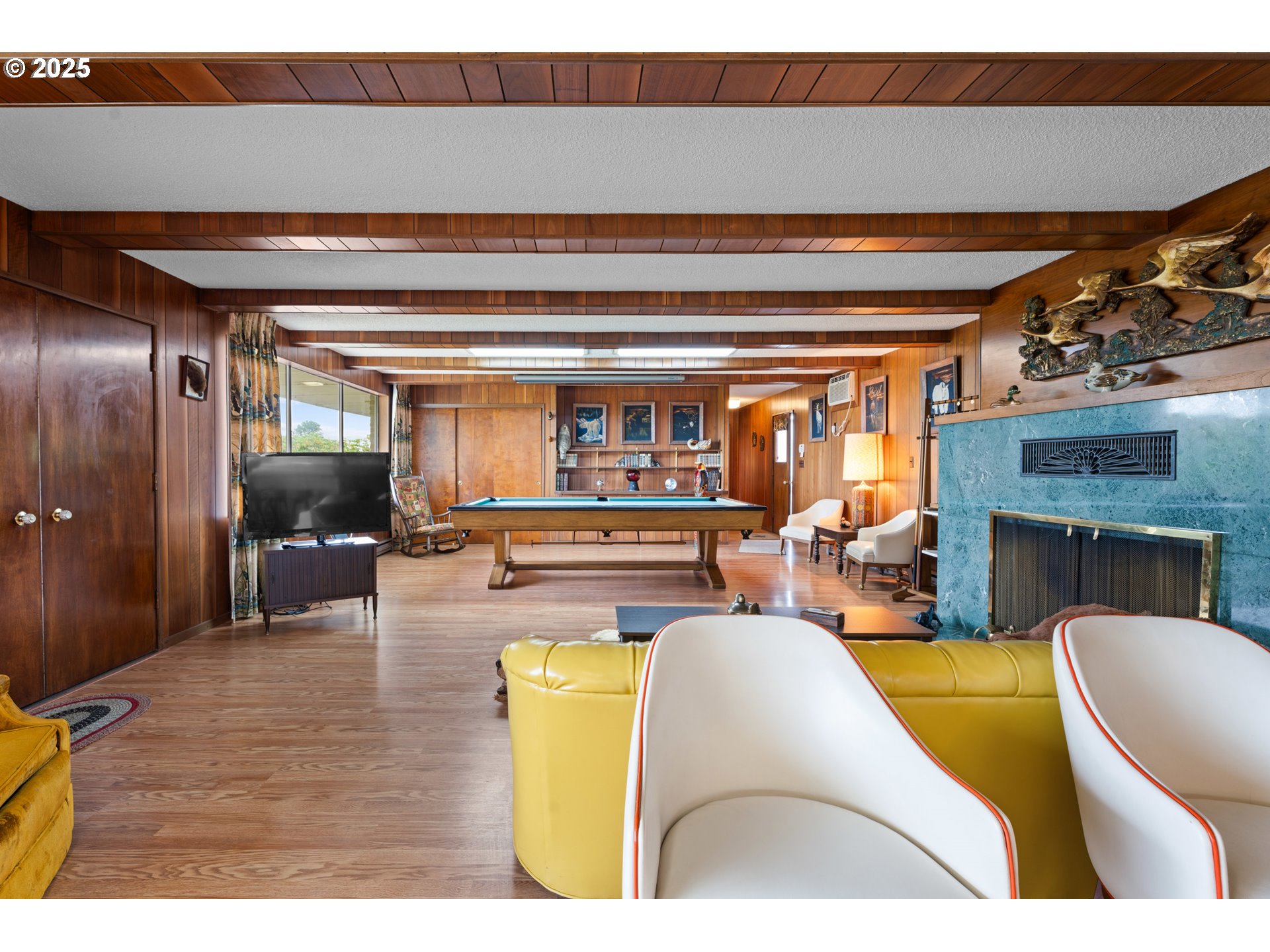53767 East Honeyman Road Scappoose, OR 97056 - Photo 12 of 46 a living room with furniture and a fireplace