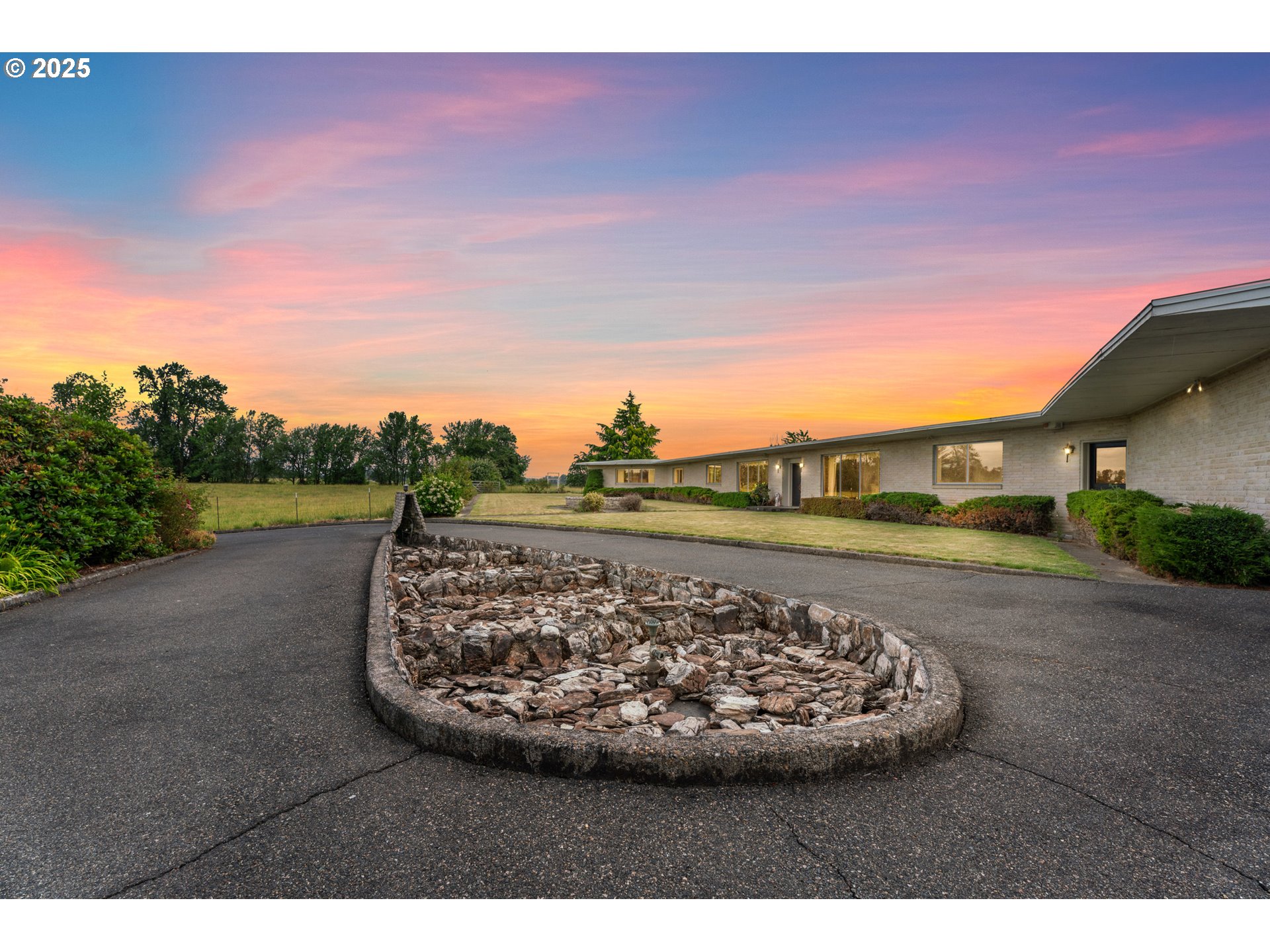 53767 East Honeyman Road Scappoose, OR 97056 - Photo 2 of 46 a view of a swimming pool with a yard
