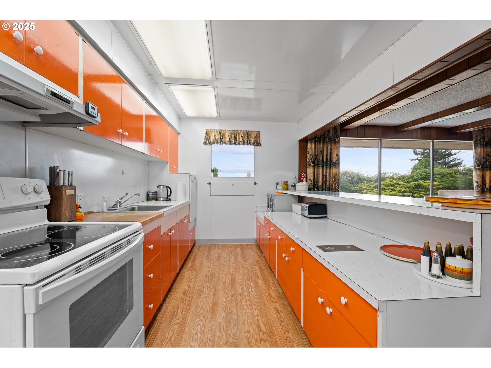 53767 East Honeyman Road Scappoose, OR 97056 - Photo 23 of 46 a kitchen with stainless steel appliances granite countertop a sink a stove and a refrigerator