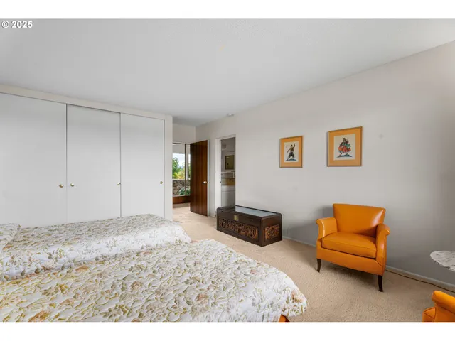 a bedroom with a bed and a couch