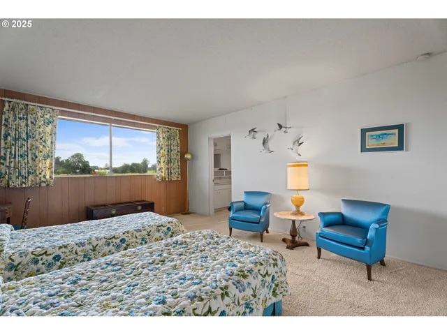 a bedroom with furniture and a window