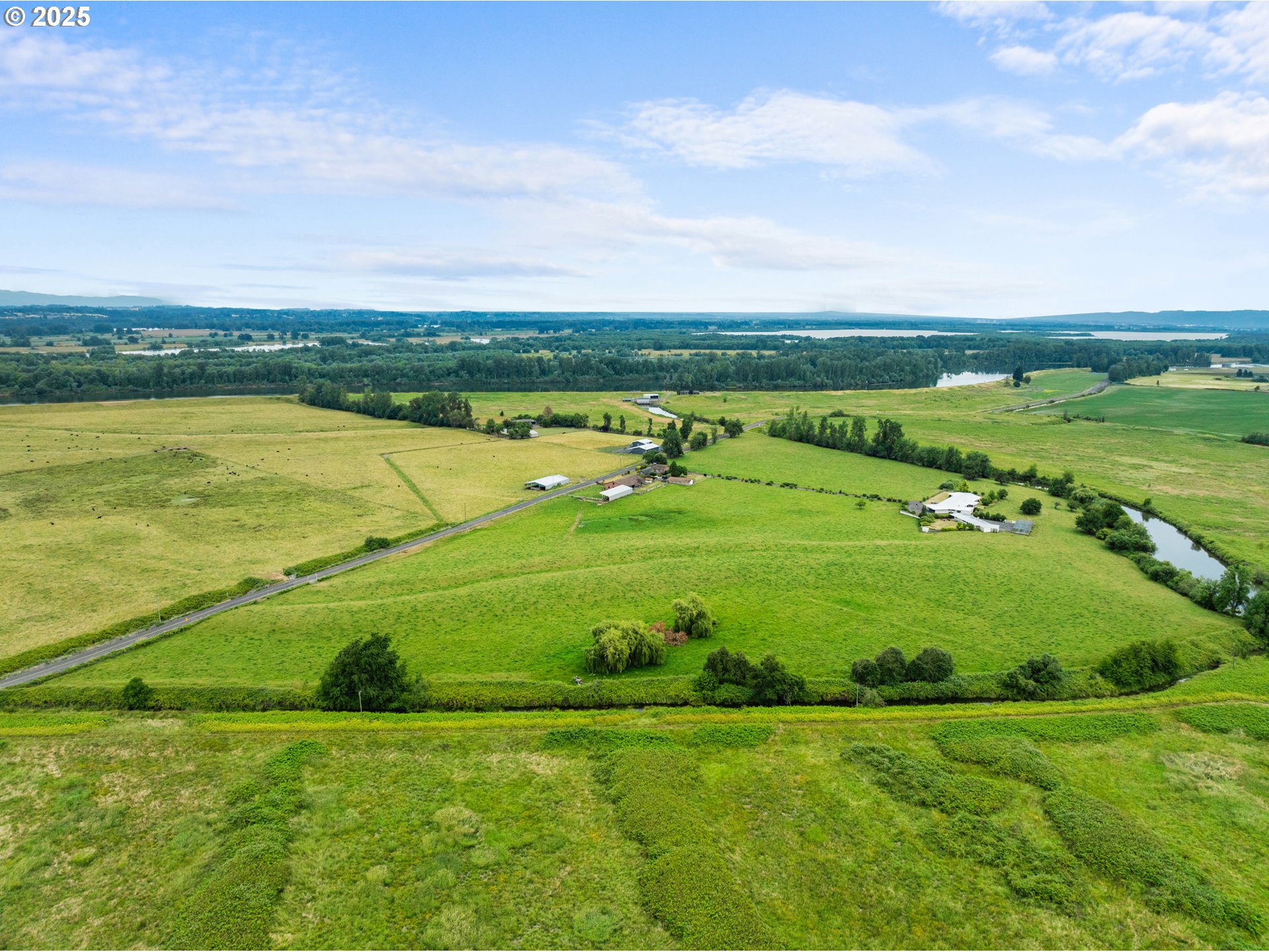 53767 East Honeyman Road Scappoose, OR 97056 - Photo 5 of 46 a view of a golf course with a building