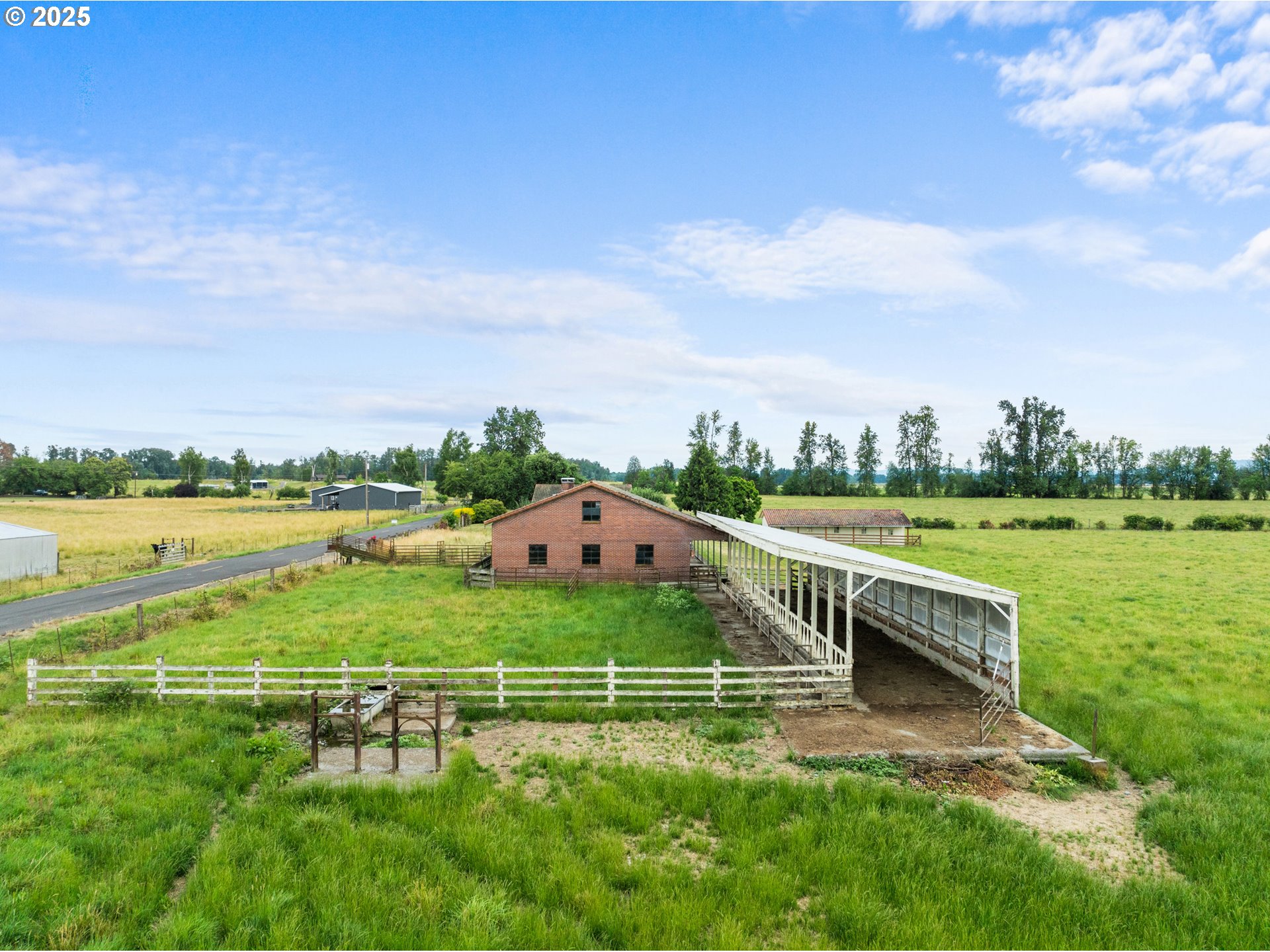53767 East Honeyman Road Scappoose, OR 97056 - Photo 7 of 46 a view of a house with a yard and sitting area