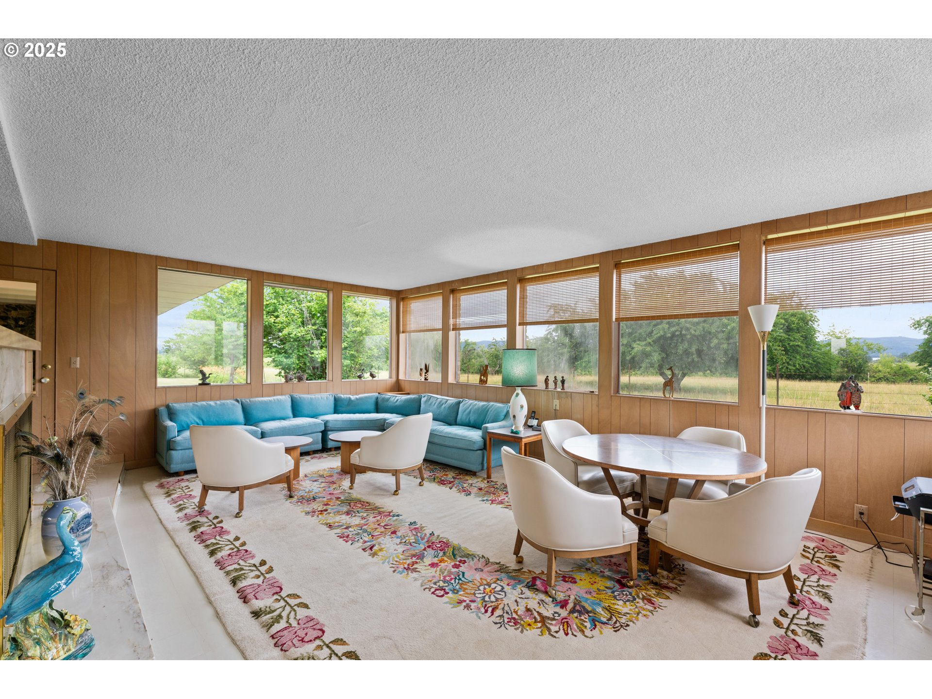 53767 East Honeyman Road Scappoose, OR 97056 - Photo 9 of 46 a living room with furniture and large windows
