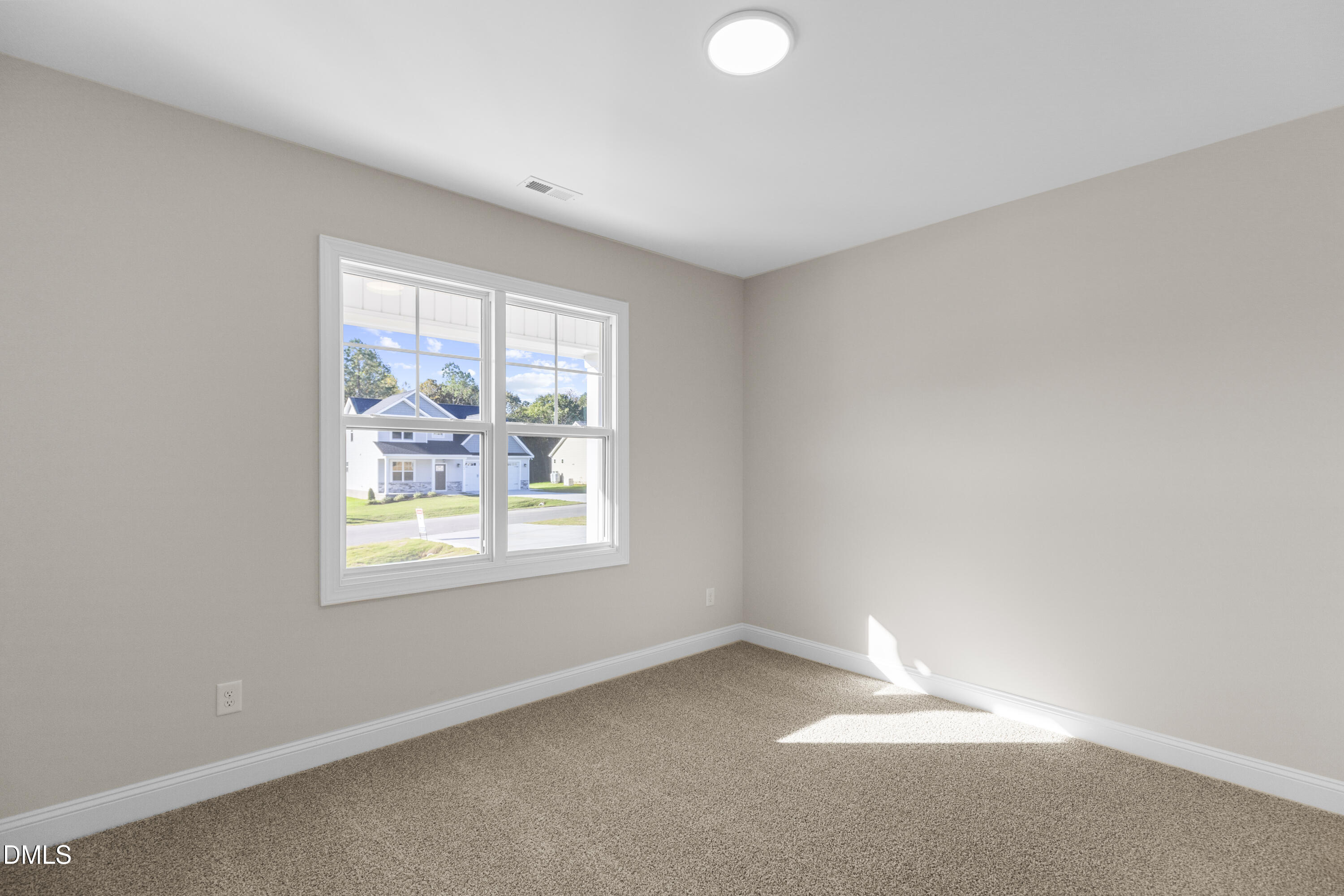 171 Surles Landing Way Benson, NC 27504 - Photo 18 of 29 an empty room with windows