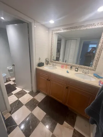 a bathroom with a sink and a mirror