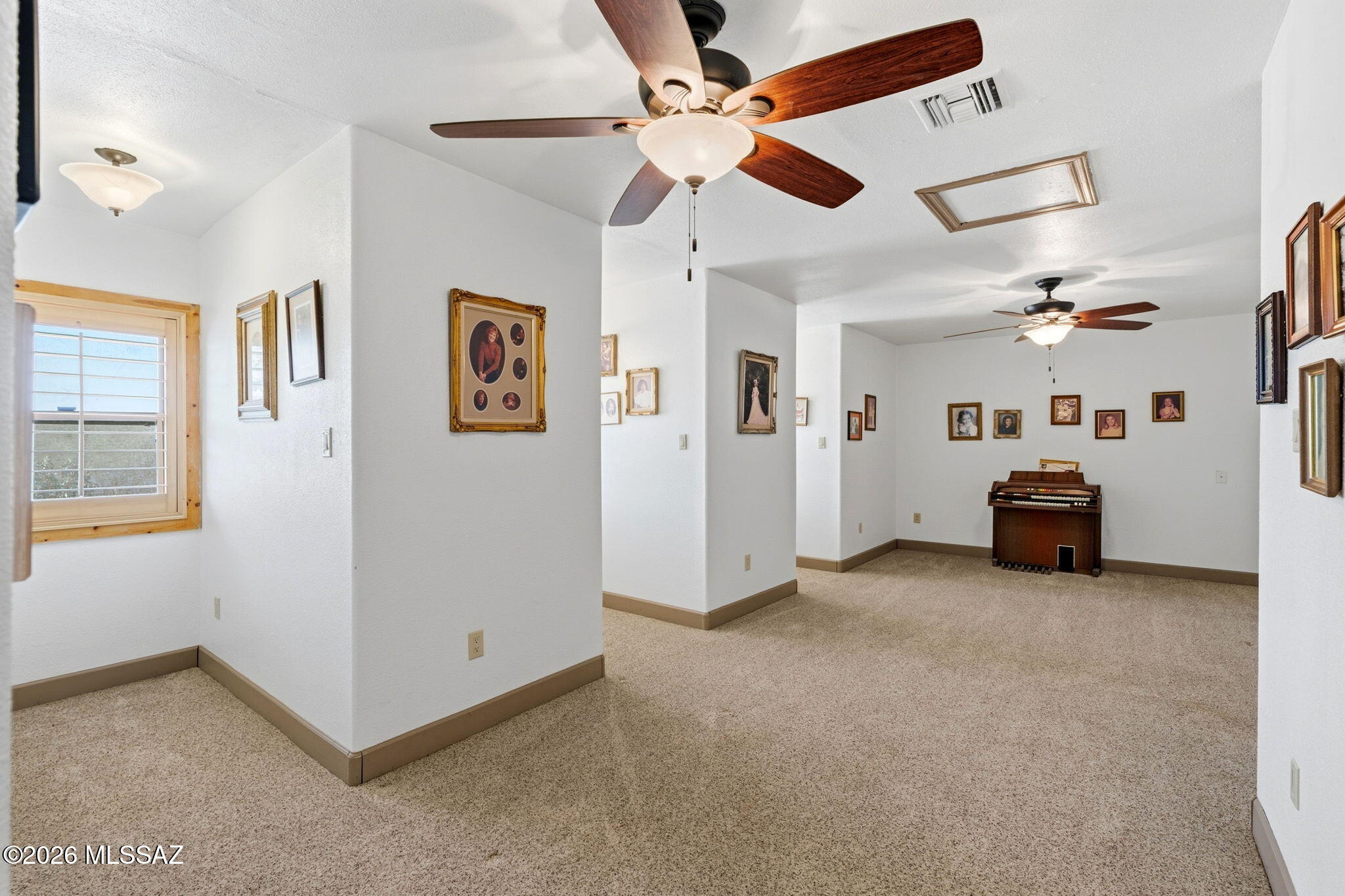 12810 West Gunsmoke Road Tucson, AZ 85736 - Photo 29 of 51 a view of a livingroom with furniture and ceiling fan