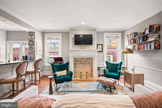 a living room with furniture fireplace and a flat screen tv