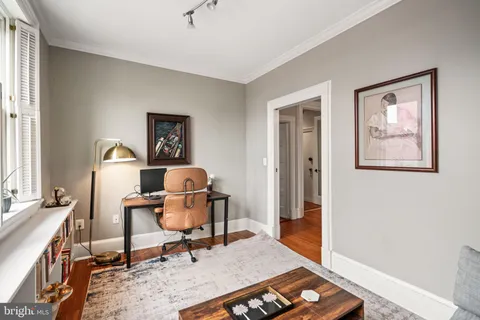 a workspace with furniture and a window