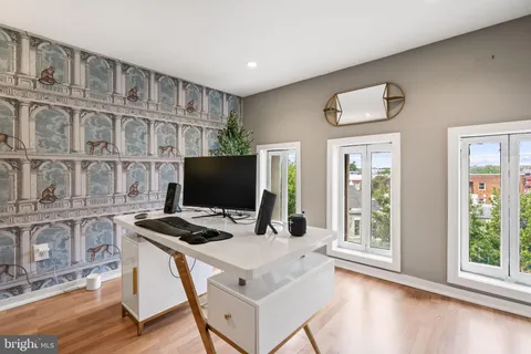 a workspace with furniture and window