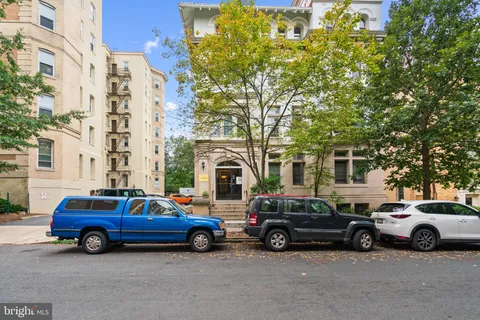 a view of cars parked in front of a building