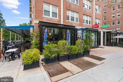 a view of a building with sitting area