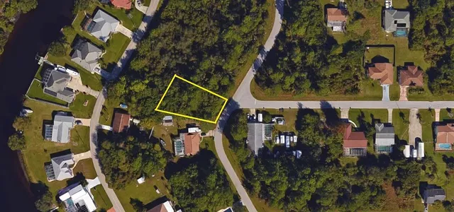 a view of a house with a yard and garage