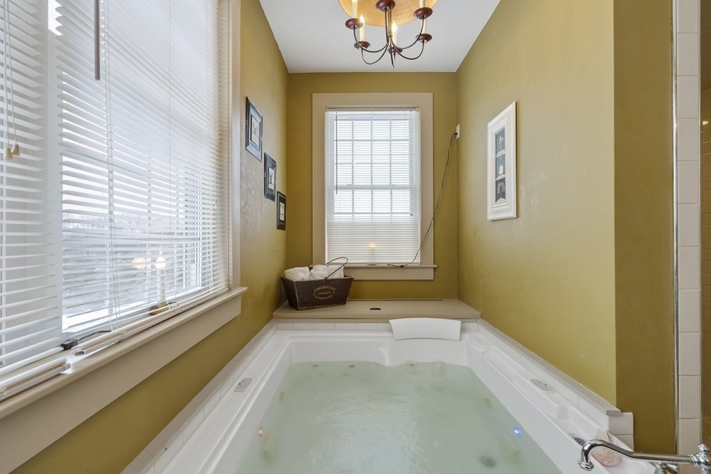 35 Piasta Road Dudley, MA 01571 - Photo 22 of 42 a spacious bathroom with a bathtub and next to a window
