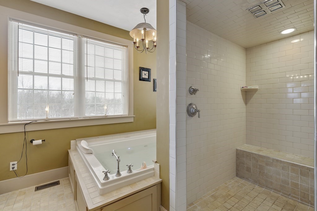 35 Piasta Road Dudley, MA 01571 - Photo 23 of 42 a bathroom with a bathtub and a shower