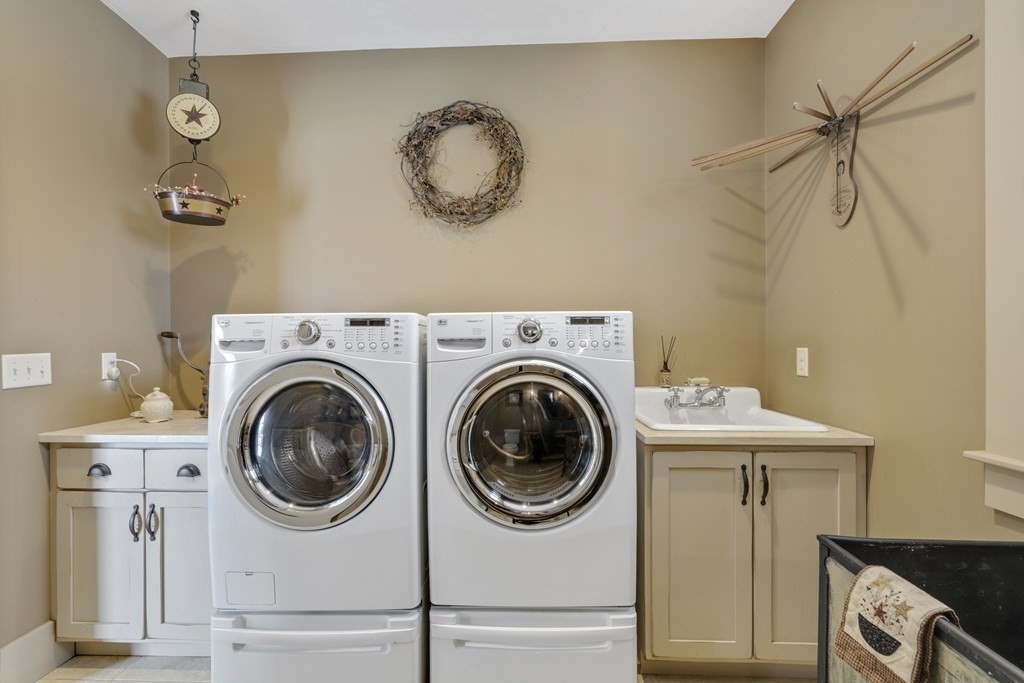 35 Piasta Road Dudley, MA 01571 - Photo 31 of 42 a view of a storage and utility room with washer and dryer