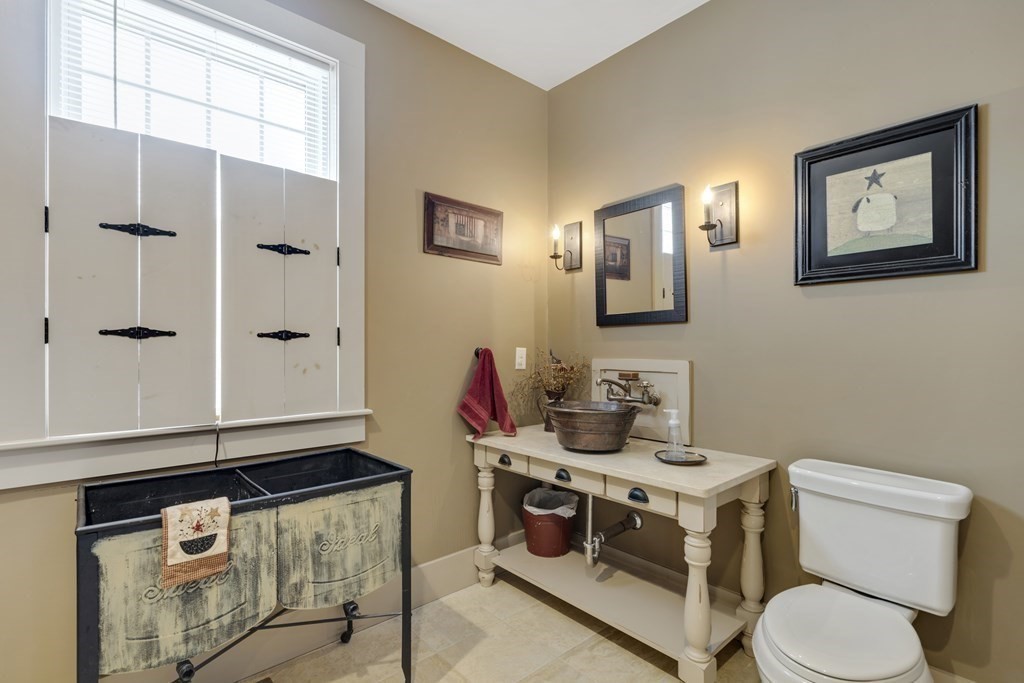 35 Piasta Road Dudley, MA 01571 - Photo 32 of 42 a bathroom with a toilet a sink and a mirror