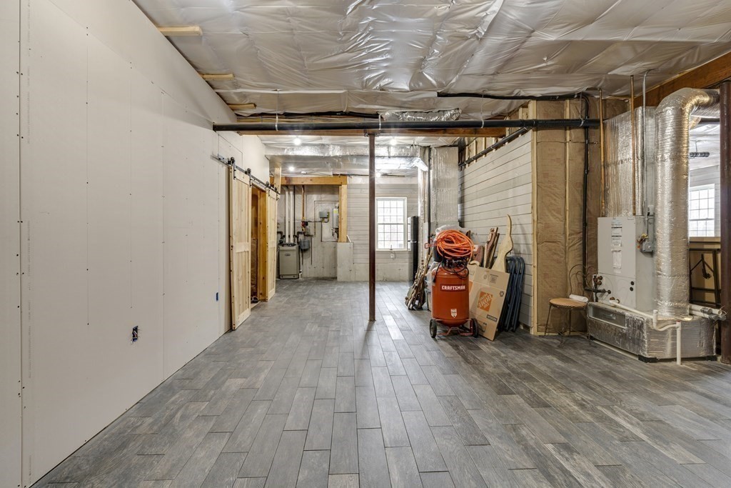 35 Piasta Road Dudley, MA 01571 - Photo 35 of 42 a view of hallway with wooden floor and furniture