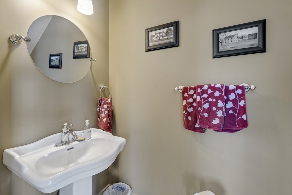 35 Piasta Road Dudley, MA 01571 - Photo 36 of 42 a bathroom with a sink mirror and vanity
